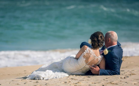 Wedding dress laying on the beach